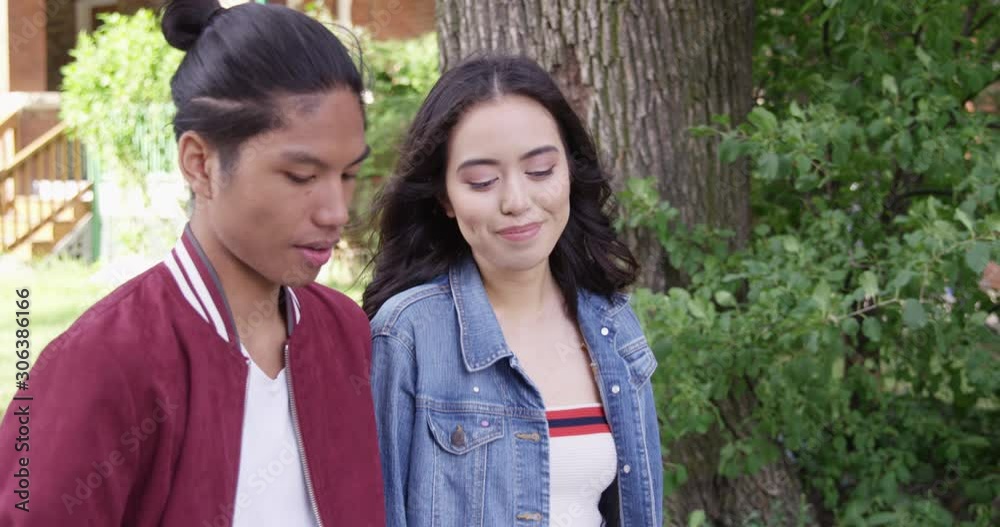 Young attractive couple on an awkward first date, walking - Slow Motion - shot on RED Young attractive couple on an awkward first date, walking - Slow Motion - shot on RED