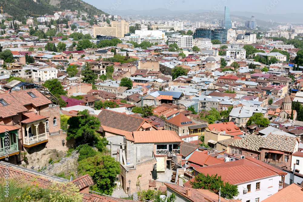 Top view on Old Tbilisi with red tiled roofs at sunny day