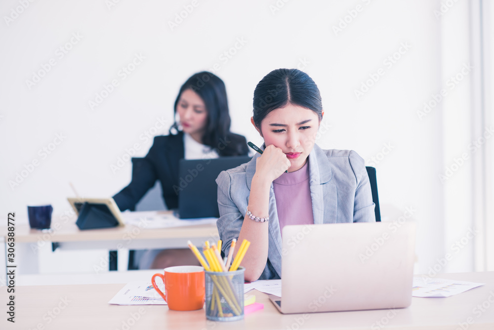 young asian business with laptop working in office. young asian business with laptop working in office.