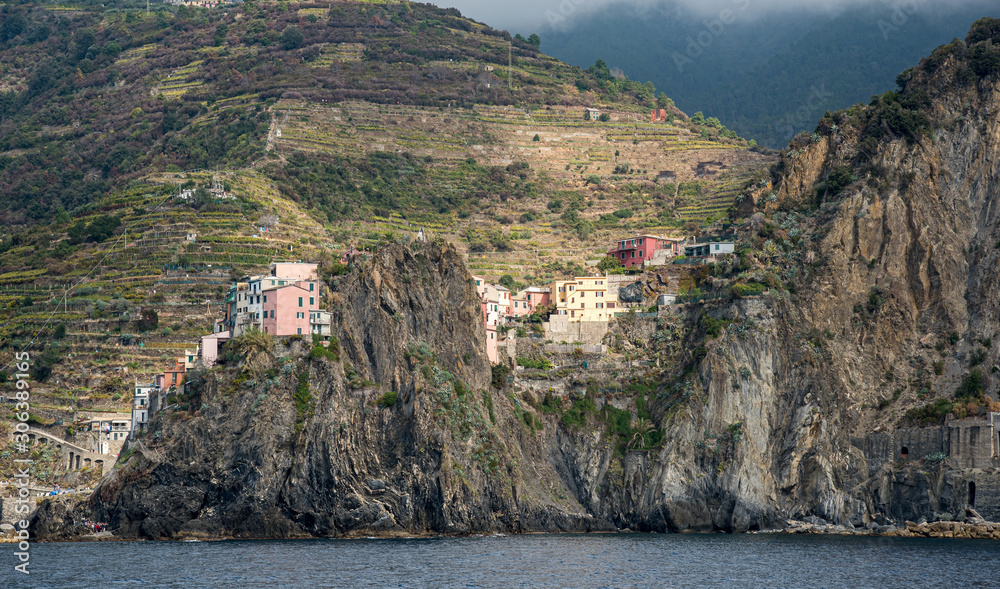 Italian village on a rocky cliff with colourful houses in Cinque Terre, Liguria, Italy
