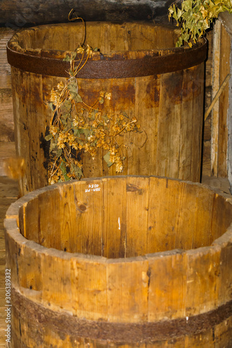 Old big wooden barrel with rusty iron circles.