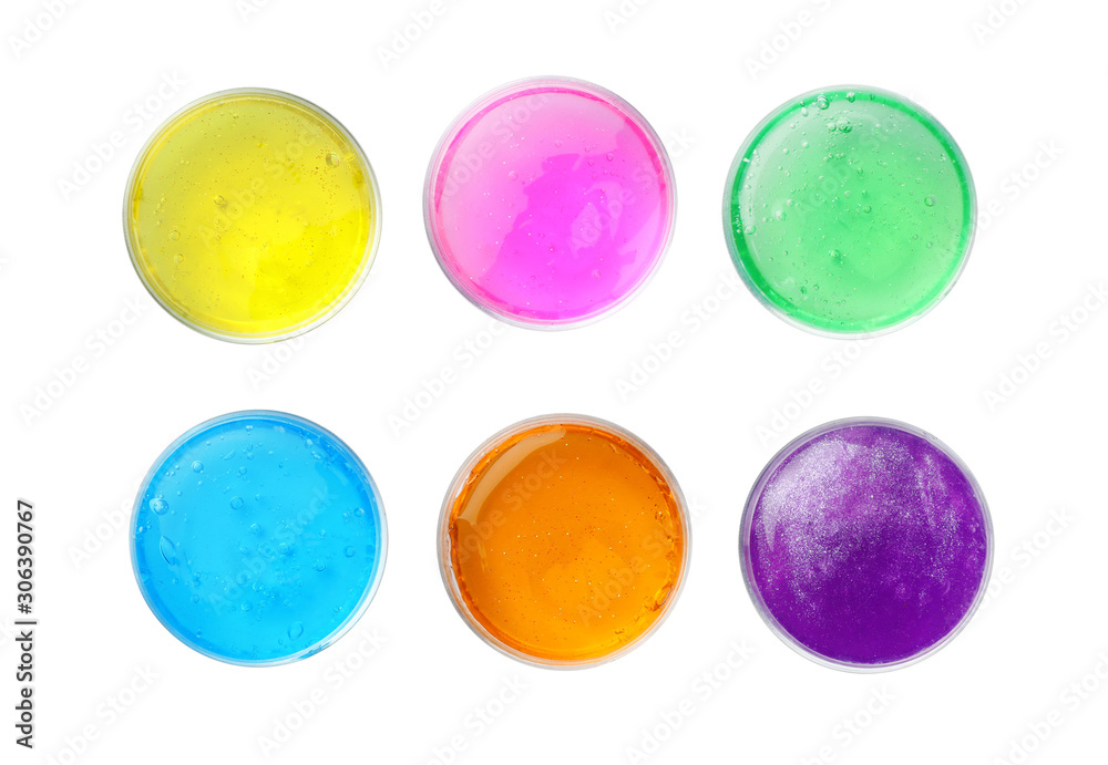 Colorful slimes in plastic containers on white background, top view. Antistress toy Colorful slimes in plastic containers on white background, top view. Antistress toy