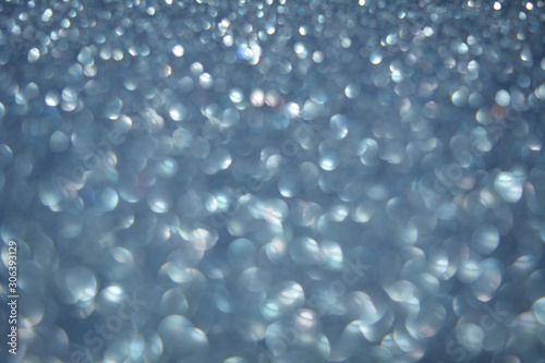 Beautiful Abstract Sparkle Glitter Lights Background. Soft Blue. Shine Bokeh Effect. For party, holidays, celebration.