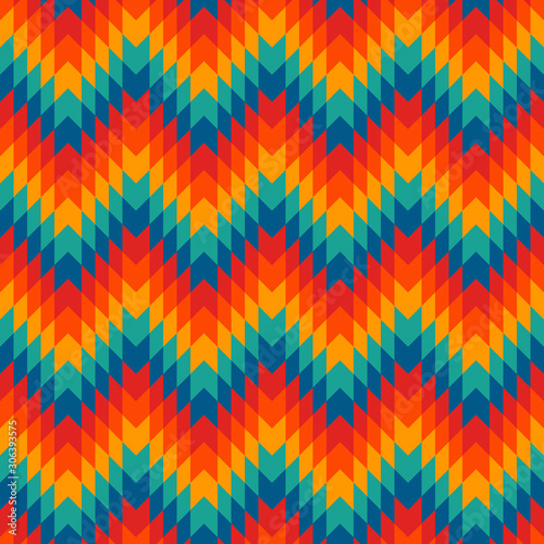 Ethnic style seamless pattern with chevron lines. Native americans ornamental background. Tribal motif. Colorful mosaic