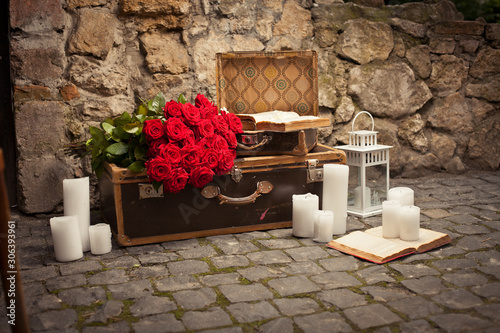 a retro suitcase, decorated with rose flowers