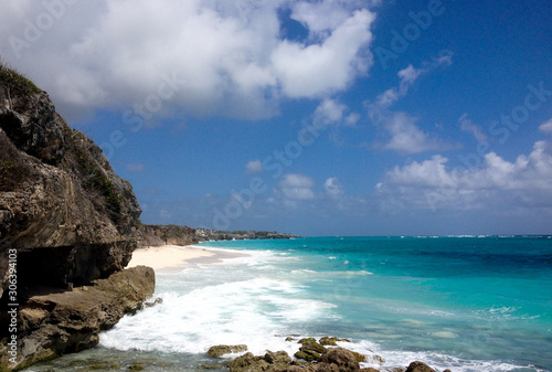 Sunny day and turquoise blue sea on the island of Barbados in the Caribbean. Trail to the beach of crystal clear water..