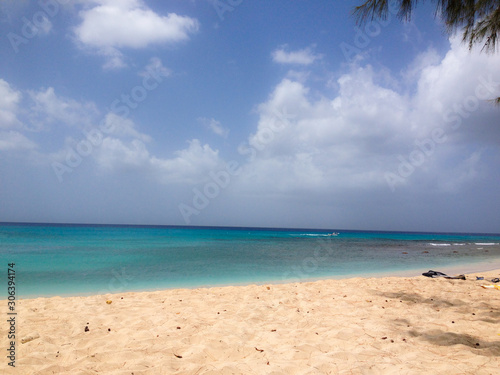 Fototapeta Naklejka Na Ścianę i Meble -  Blue sea turquoise on Barbados Caribbean beach in sunny day and blue sky.