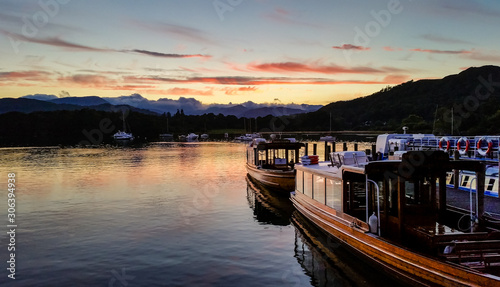 Still Windermere lake at sunset time in Ambleside, Lake District, UK.