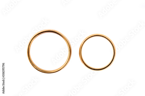 Two golden wedding rings isolated on white, wedding rings background concept