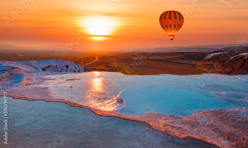 Hot air balloon flying over spectacular pamukkale - Natural travertine pools and terraces in Pamukkale. Cotton castle in southwestern Turkey, photo
