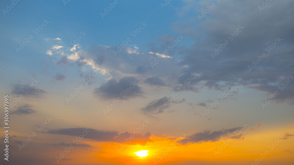panorama of dramatic sunset over cloudy sky