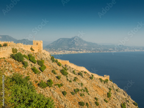 Alanya, Turkey. Beautiful panoramic top view of the city Alanya, the Mediterranean Sea, the fortress Alanya Castle. Vacation postcard background