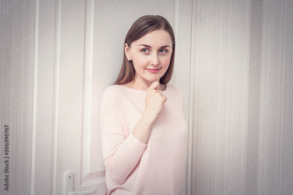 Sly girl hiding behind the door, woman playing hide and seek, portrait, toned Sly girl hiding behind the door, woman playing hide and seek, portrait, toned