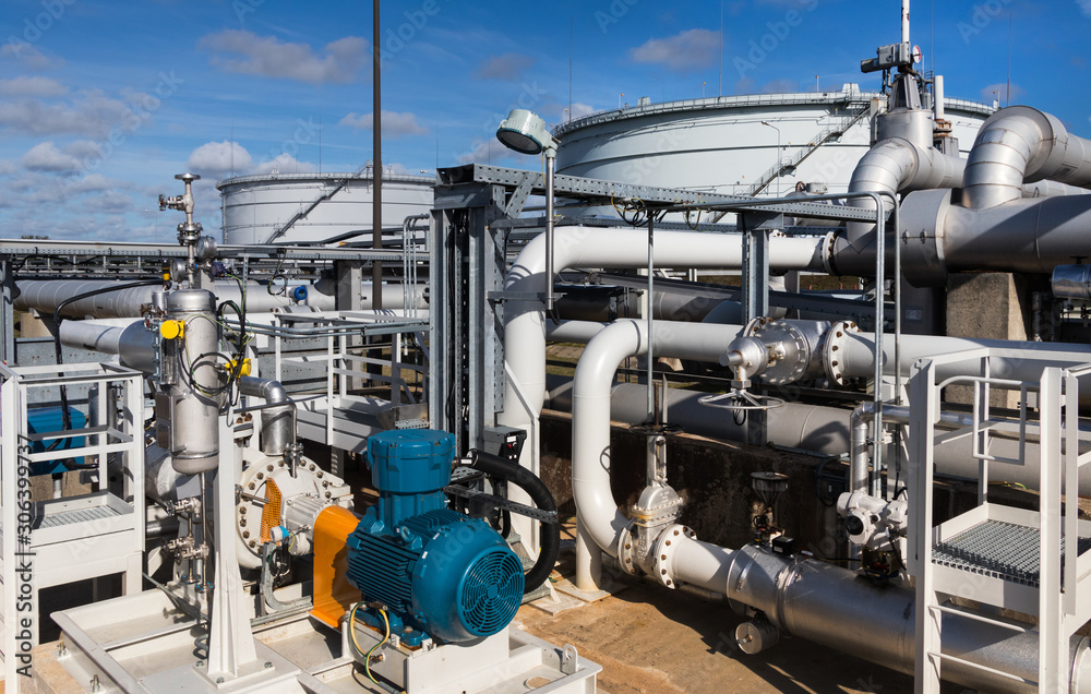 Pipes machinery, tanks and steam turbine at plant Pipes machinery, tanks and steam turbine at plant