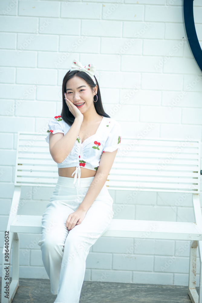 An Asian girl who is happy, attractive, and she is cute. An Asian girl who is happy, attractive, and she is cute.
