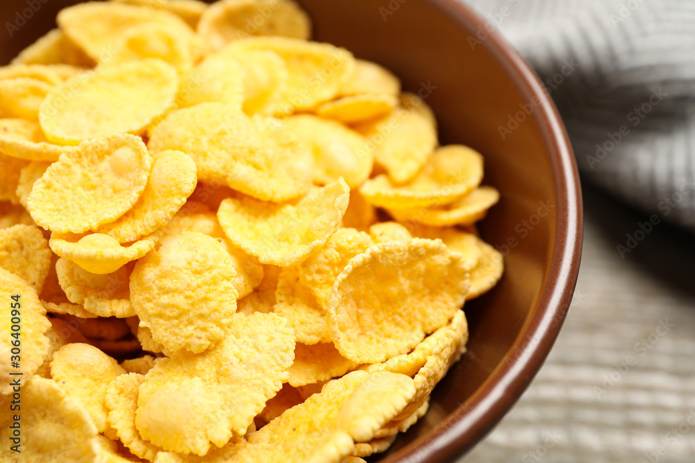 Tasty crispy corn flakes in bowl, closeup Tasty crispy corn flakes in bowl, closeup