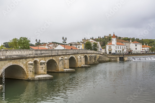 Full View at the Tomar city downtown with bridge and river, Convent of Christ a Roman Catholic convent in Tomar as background