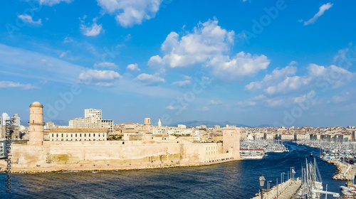 Marseille, France - The Old Port of Marseille with historical Fort Saint Jean and the lighthouse tower tour du fanal.