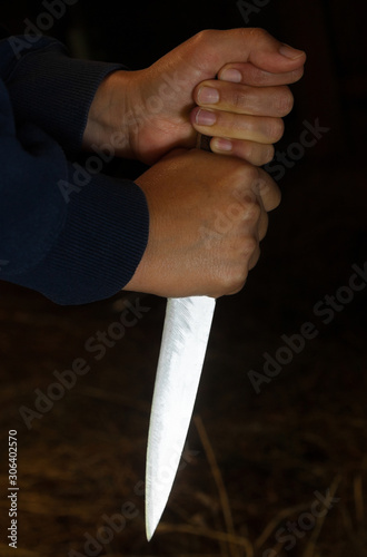 Hands holding a big sharp knife © rootstocks