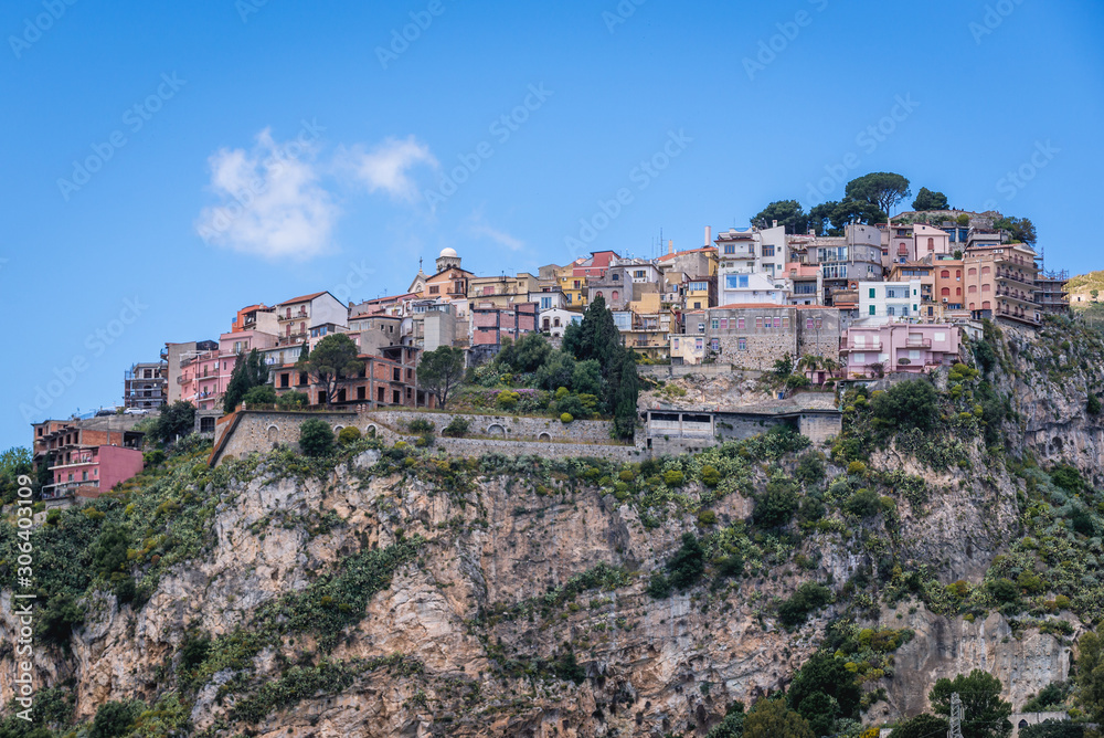 Small Castelmola village on a rocky mount seen from Way of Cross stairs in Taormina city, Sicily Island, Italy