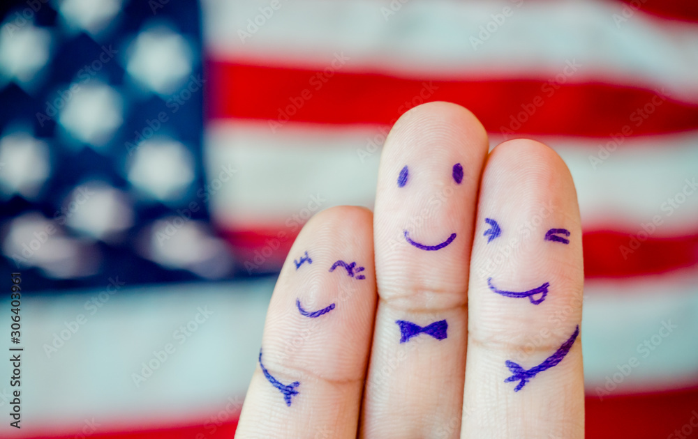 Naklejka premium Happy family finger of loving father and mother with son with smiley face on American flag background copy space.