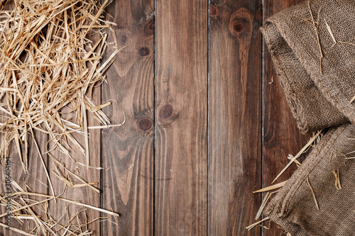 Wooden floor background and dry straw