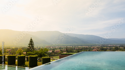 Outdoor swimming pool background is beautiful big mountain in thailand