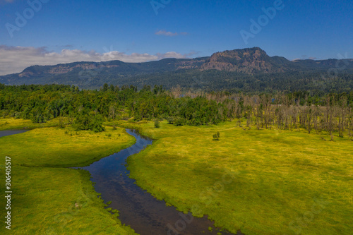 Aerial view of a stream leading toward the Columbia River © Michael