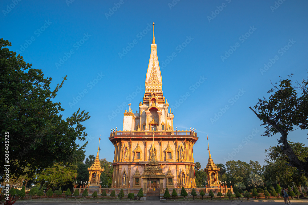 Chalong pagoda in blue sky. Wat Chalong is the largest and most revered in Phuket..all tourists like to visit Chalong temple.The beautiful temple complex was built in Thai East style.