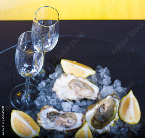 Food. oysters on ice and lemon