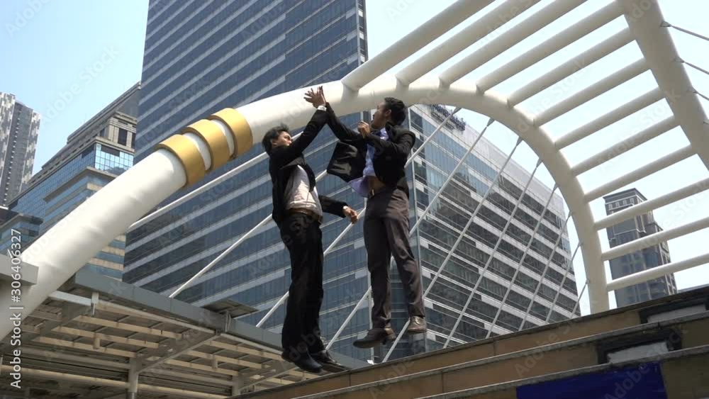 Slow motion two happy Asian businessman Slow motion two happy Asian businessman