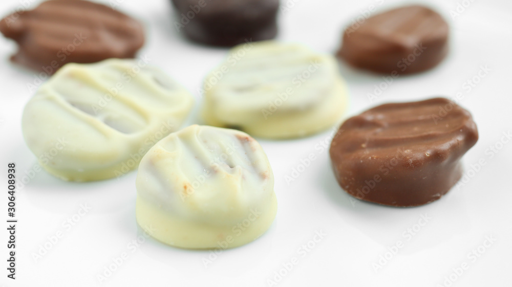 Handmade white, milk and dark chocolate on a white background Handmade white, milk and dark chocolate on a white background