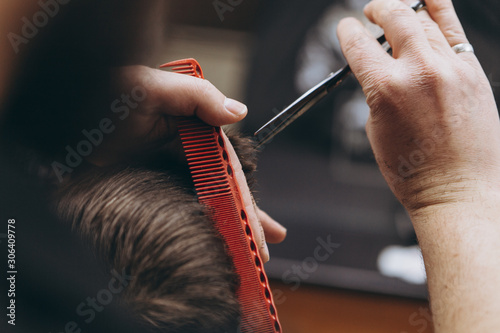 haircut, shaving and modeling beard and hairstyles in barbershop, cozy barbershop, close-up photo work