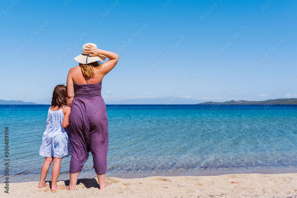Mother And Little Daughter Walking Along Tropical Beach Mother And Little Daughter Walking Along Tropical Beach