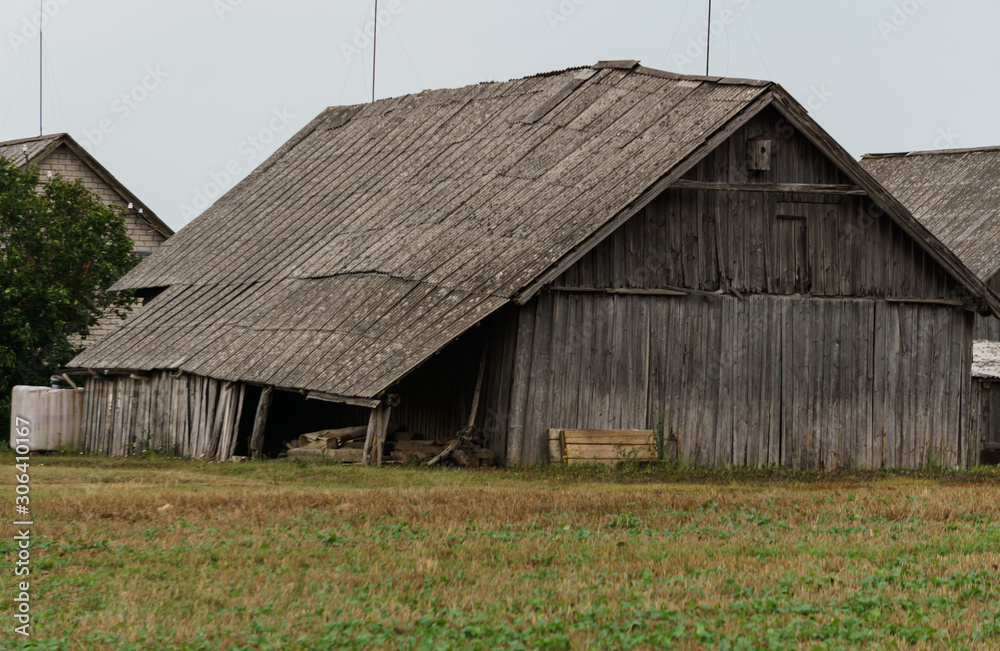 Naklejka premium Old wooden buildings in the village, built in the middle of the last century.