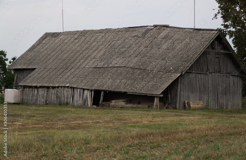 Old wooden buildings in the village, built in the middle of the last century. Old wooden buildings in the village, built in the middle of the last century.