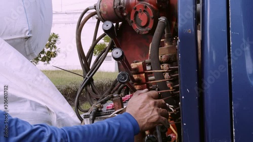 mechanic at work with mobile crane