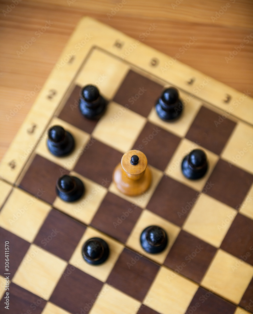 King encircled by the pawns. Chess pieces. King encircled by the pawns. Chess pieces.