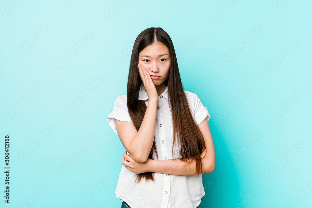Young pretty chinese woman who is bored, fatigued and need a relax day. Young pretty chinese woman who is bored, fatigued and need a relax day.