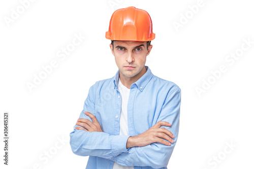 Serious builder in hardhat, isolated background, copy space