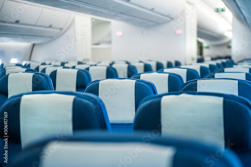 Row of seats economic class airplane photo