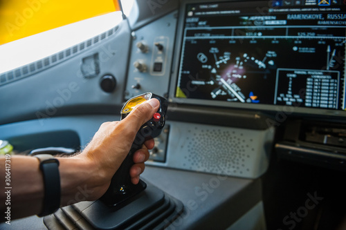 Hand on sidestick control of airplane