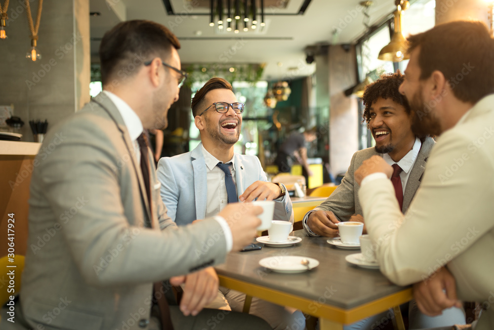 Funny conversation four businessmen while sit pub and drinking coffee after work