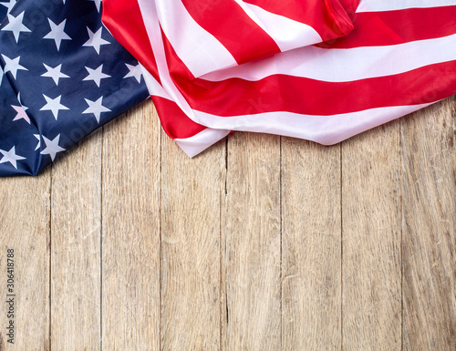 US flag on wooden background.