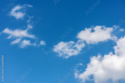 Blue sky with fluffy clouds, abstract background