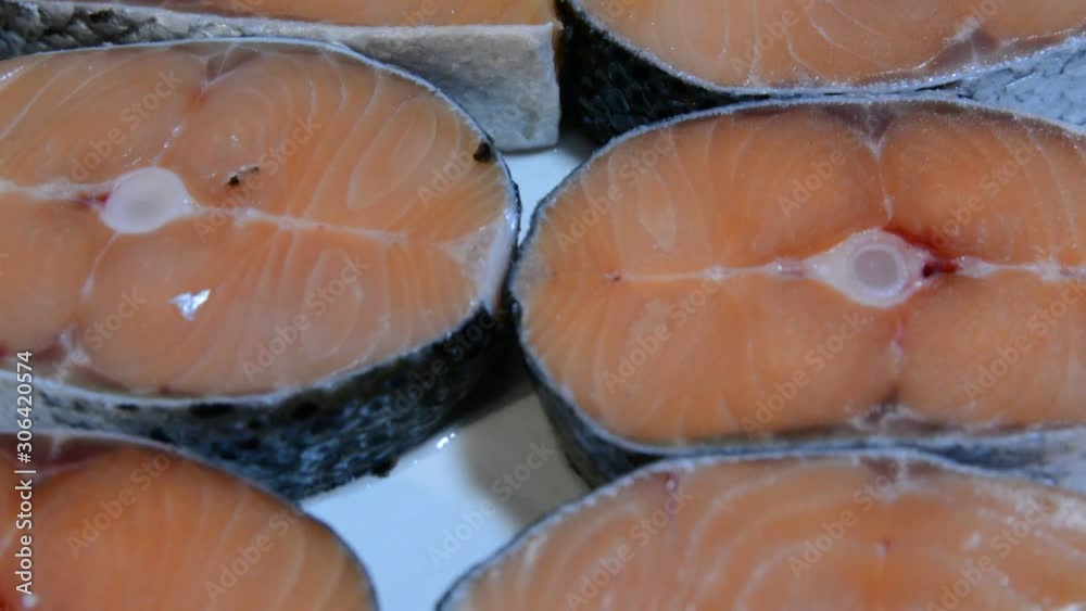 Close up fresh salomon steak. fresh fish counter full with diverse - organic fish meat Close up fresh salomon steak. fresh fish counter full with diverse - organic fish meat