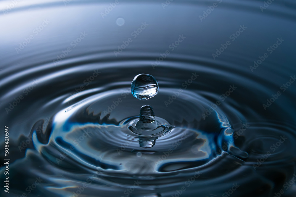 Splash of water close-up. Water drop. A blue drop of water. Falling water. The rain closeup. Splash of water close-up. Water drop. A blue drop of water. Falling water. The rain closeup.