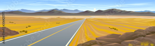 A highway across the hot desert landscape photo