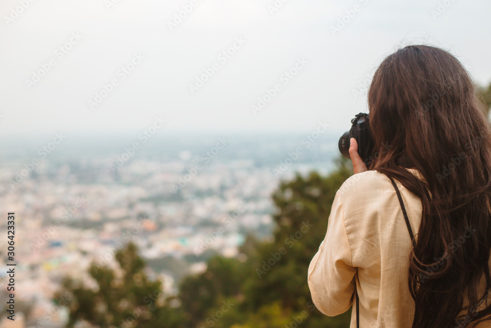 Long haired woman taking photos Long haired woman taking photos