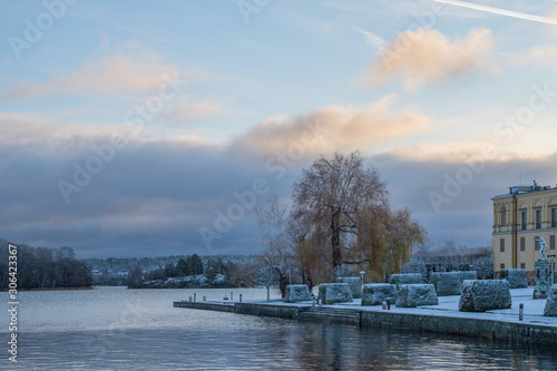Snowy sunset pier view at the Drottningholm island in Stockholm